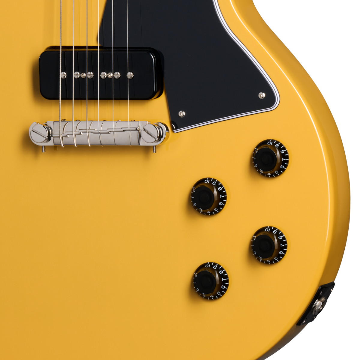 Yellow electric guitar body with four black control knobs, a black rectangular pickup, silver bridge, and a black pickguard with white trim.