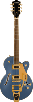 Gretsch electric guitar in metallic blue with a gold pickguard, gold hardware, dual pickups, two f-holes, and a Bigsby tremolo arm.