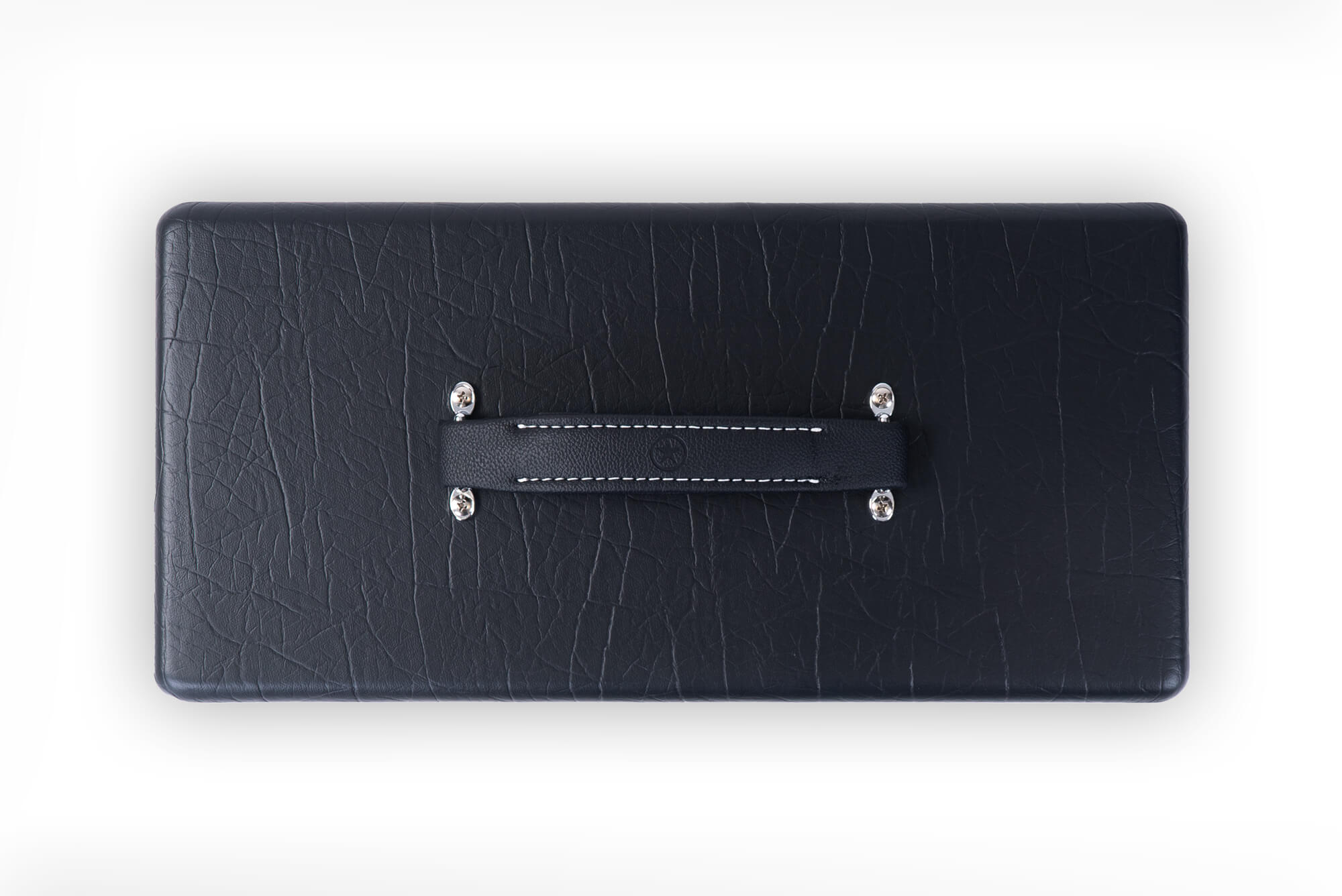 Rectangular black textured amp case with a black handle stitched in white, attached by four metal bolts, viewed from above.