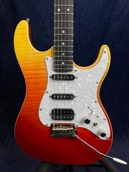 Electric guitar with a red-to-yellow sunburst body, white pearloid pickguard, three pickups, and a whammy bar.