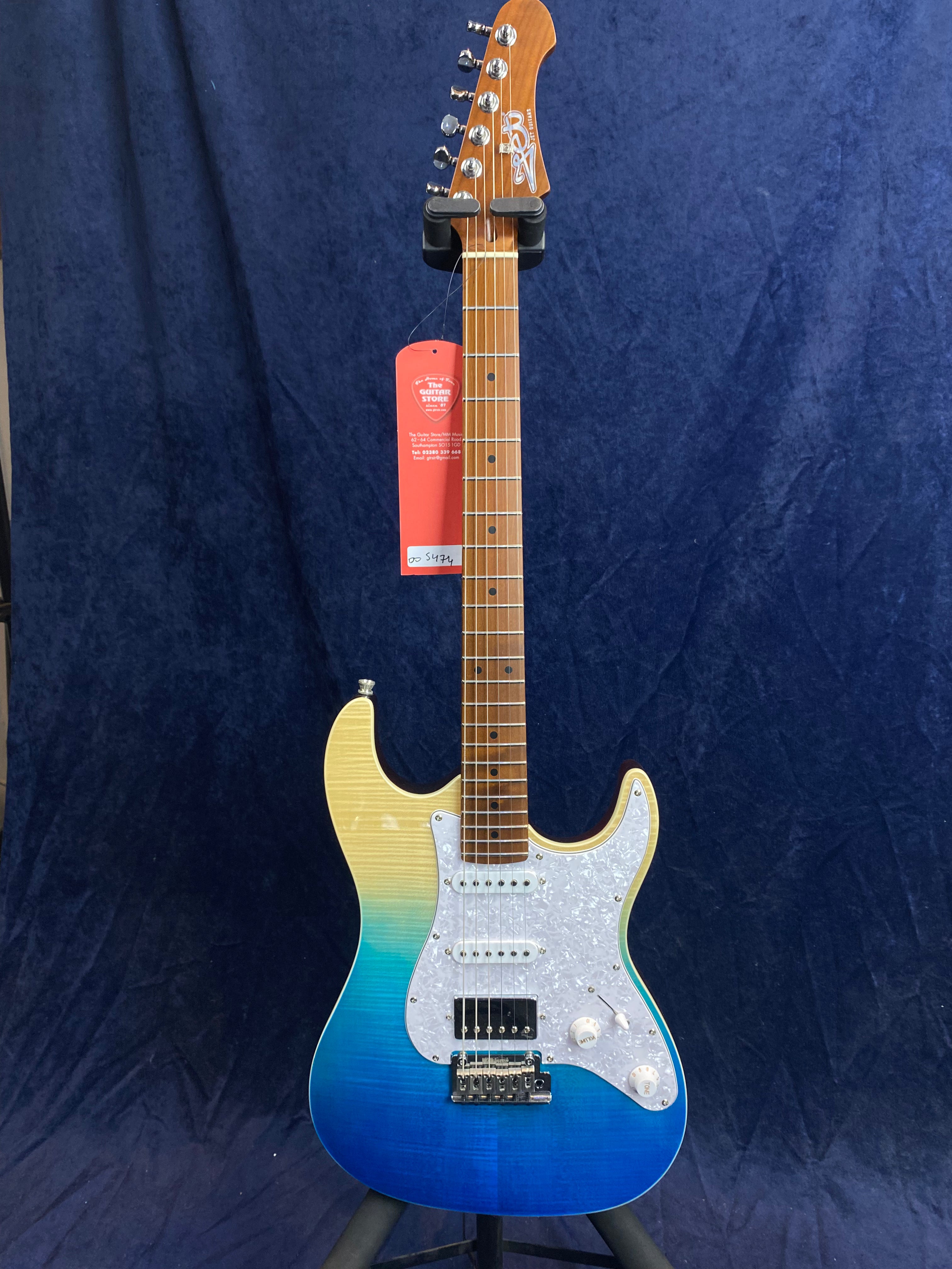 Electric guitar with a glossy gradient body fading from yellow at the top to blue at the bottom, white pickguard, and brown fretboard.