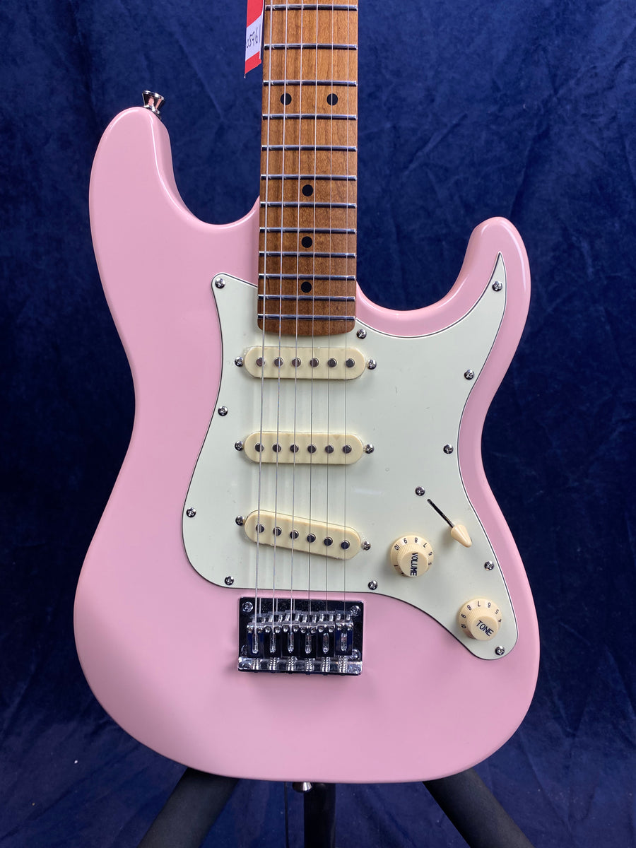Light pink electric guitar with three cream pickups, white pickguard, two knobs, and a brown fretboard against a dark background.