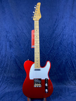 Red electric guitar with a white pickguard, chrome hardware, two pickups, and a light maple neck and fretboard against a solid blue background.