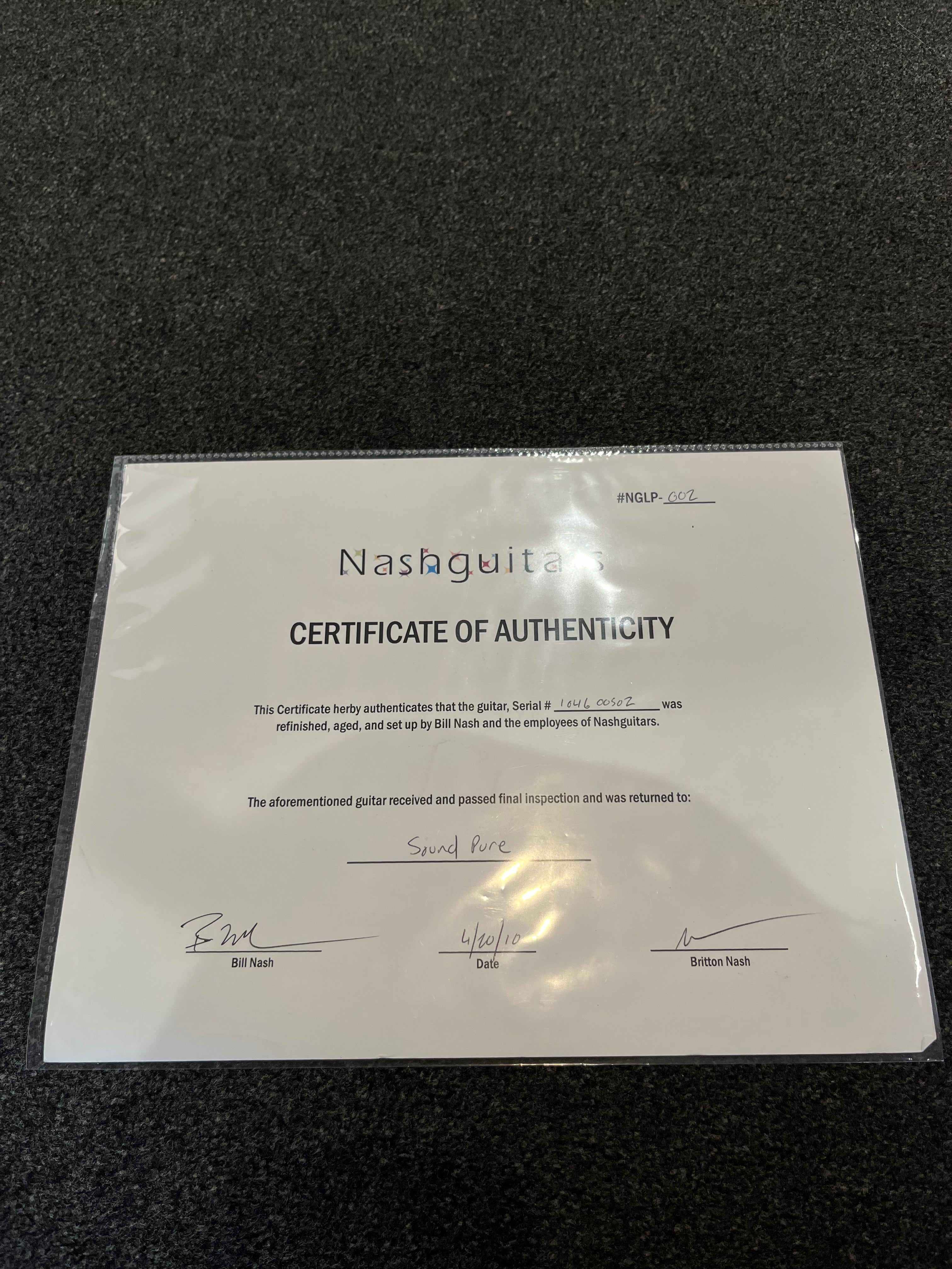 Nashguitars Certificate of Authenticity for an electric guitar, signed by Bill and Britton Nash, dated 4/10/10, returned to Sound Pure.