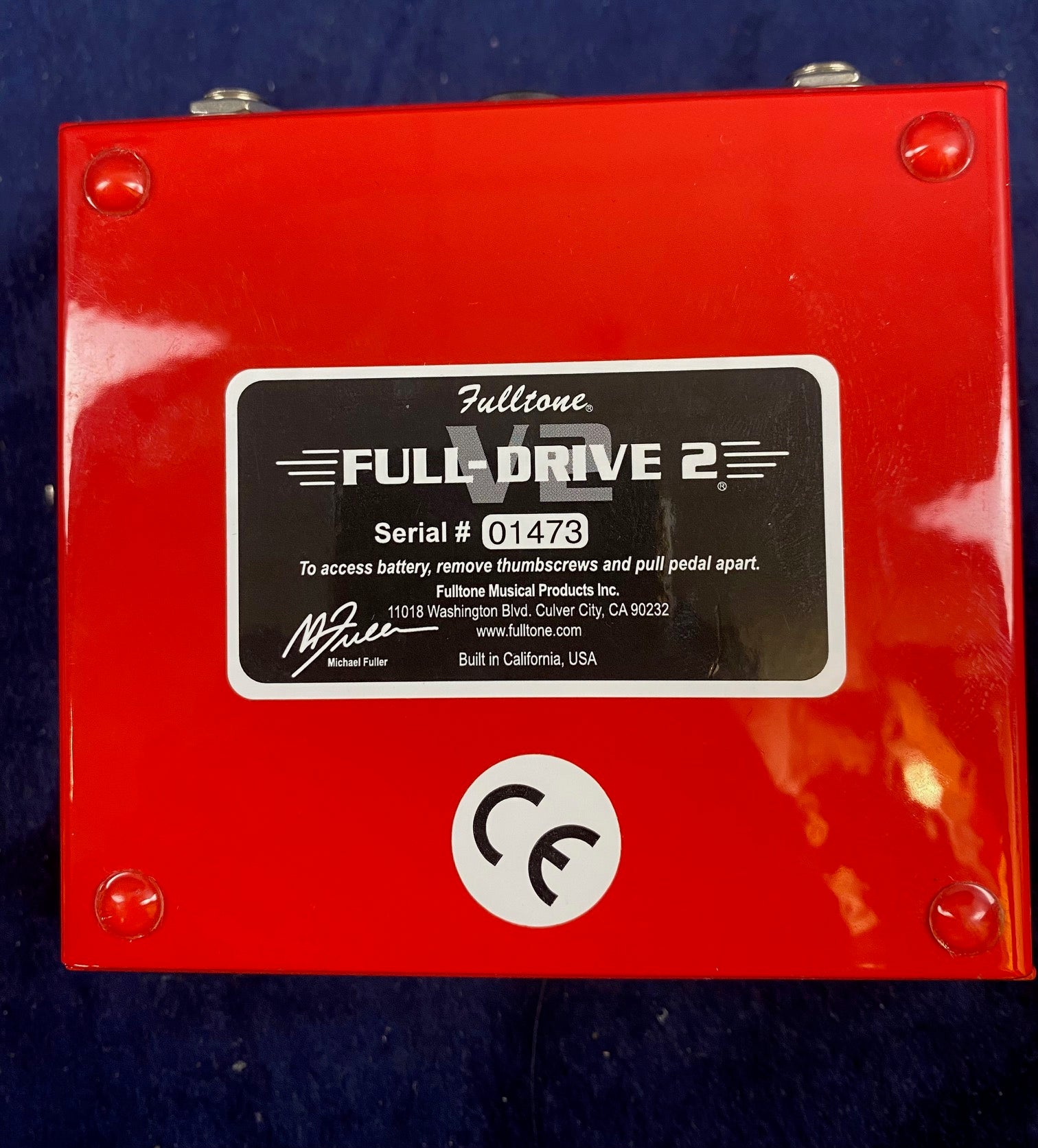 Red Fulltone Full-Drive 2 FX pedal bottom with black label, serial number 01473, CE mark, and instructions for battery access.