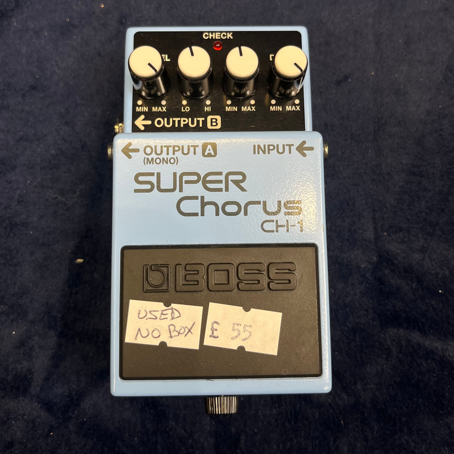 Light blue Boss Super Chorus CH-1 guitar pedal with four white knobs, sticker labels reading "USED NO BOX" and "£55" on the black footswitch.