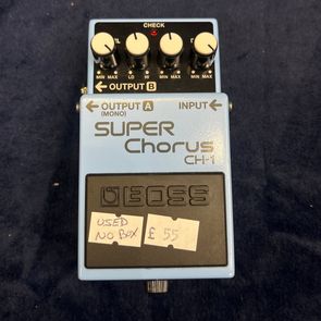 Light blue Boss Super Chorus CH-1 guitar pedal with four white knobs, sticker labels reading 