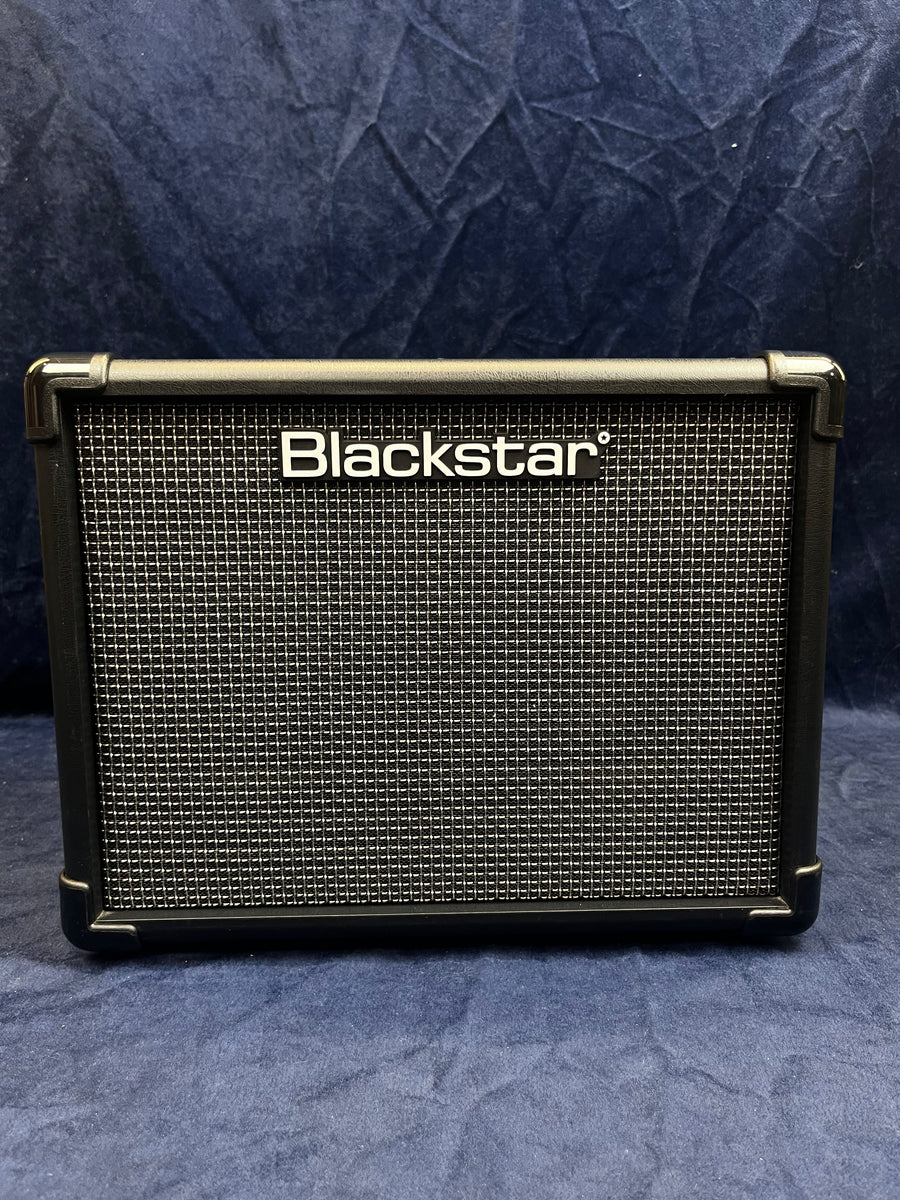 Blackstar guitar amplifier with a black and silver grid front, rectangular shape, and Blackstar logo in white across the top center.