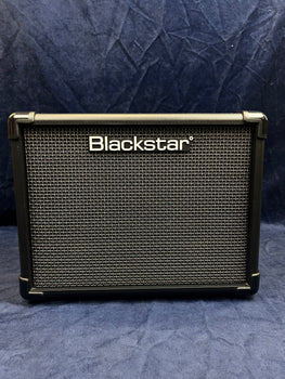 Blackstar guitar amplifier with a black and silver grid front, rectangular shape, and Blackstar logo in white across the top center.