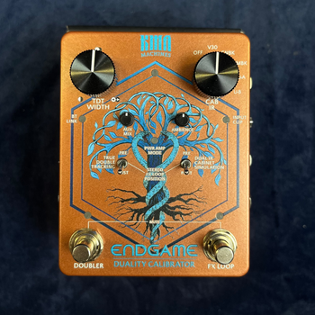 Copper-colored FX pedal with a blue tree design, labeled 