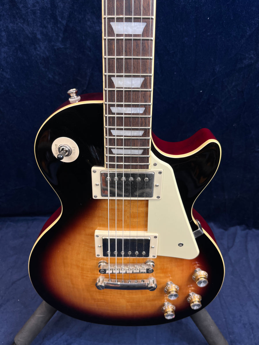 Epiphone electric guitar with a sunburst finish, two humbucker pickups, four gold control knobs, and a cream pickguard.