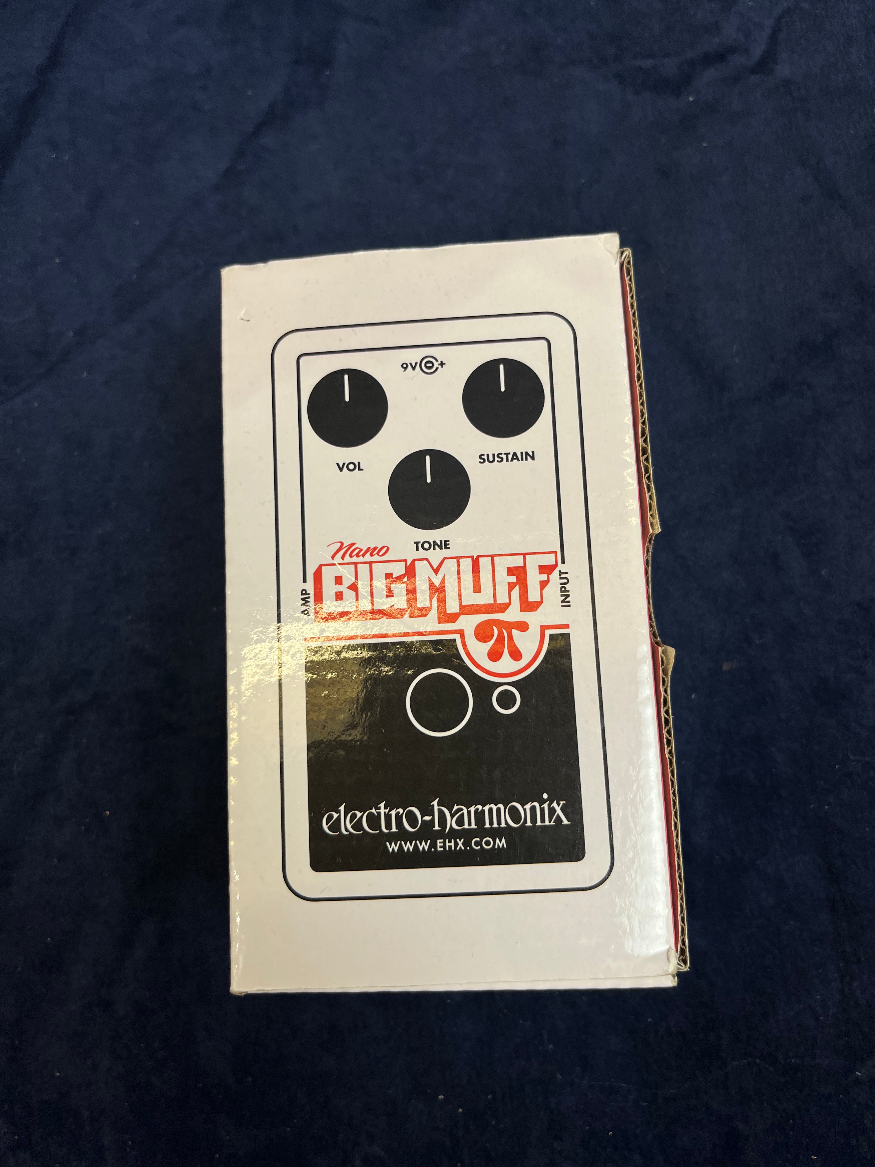 Electro-Harmonix Nano Big Muff FX pedal box features graphics showing three control knobs labeled Vol, Sustain, Tone, and the Electro-Harmonix logo.