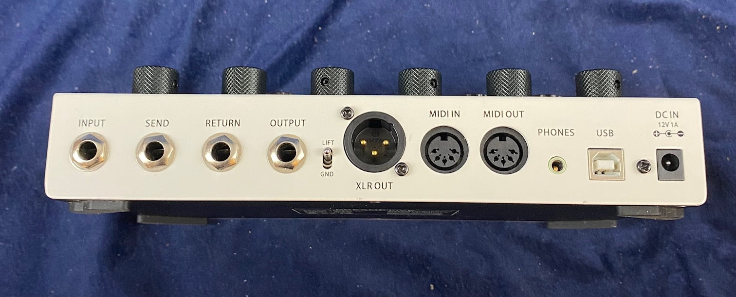 Rear panel of FX Pedals with input, send, return, output, XLR out, MIDI in/out, phones, USB, and DC in ports, plus ground lift switch.
