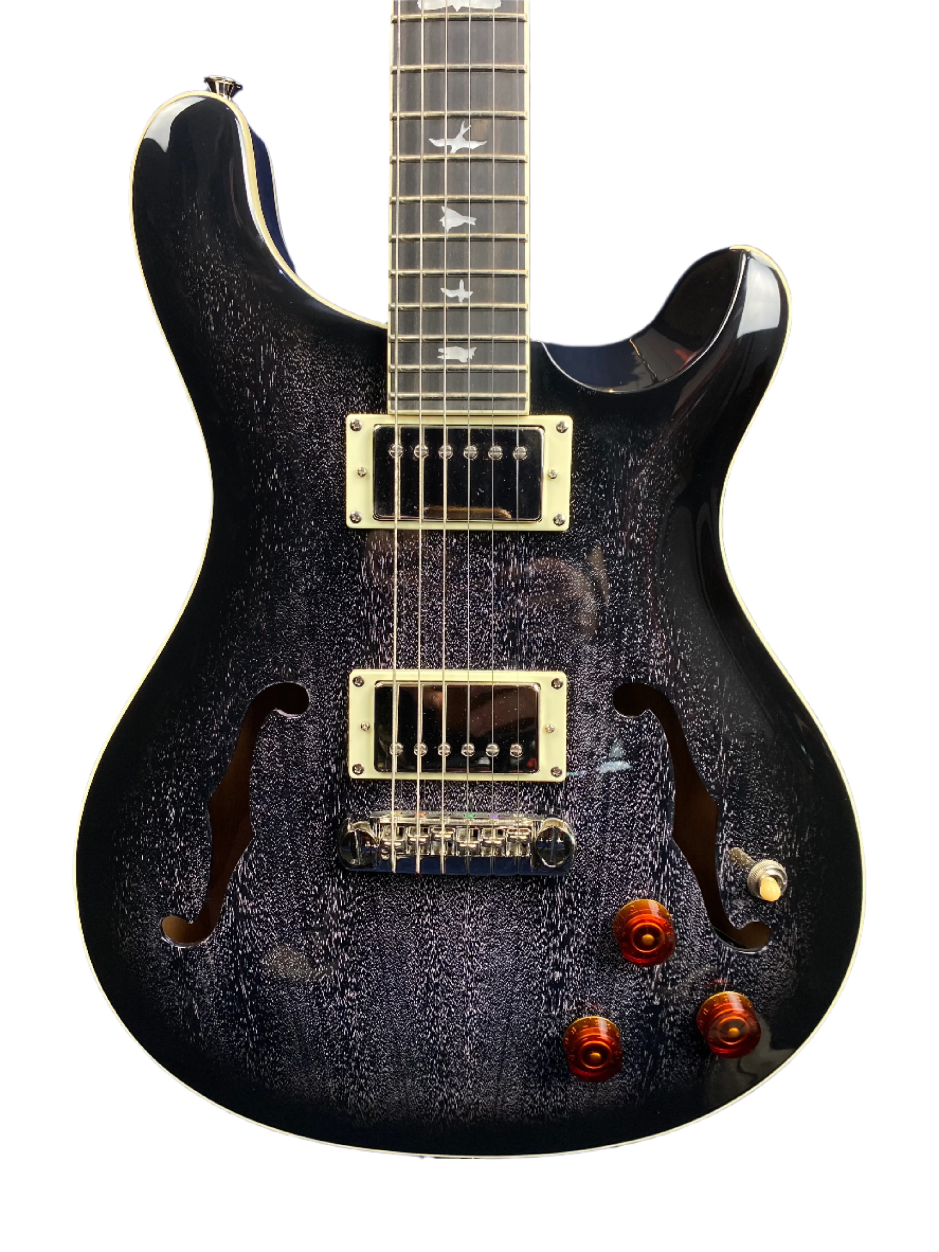 Electric guitar with a dark, textured finish, two F-holes, two humbucker pickups, bird inlays on the fretboard, and three amber control knobs.