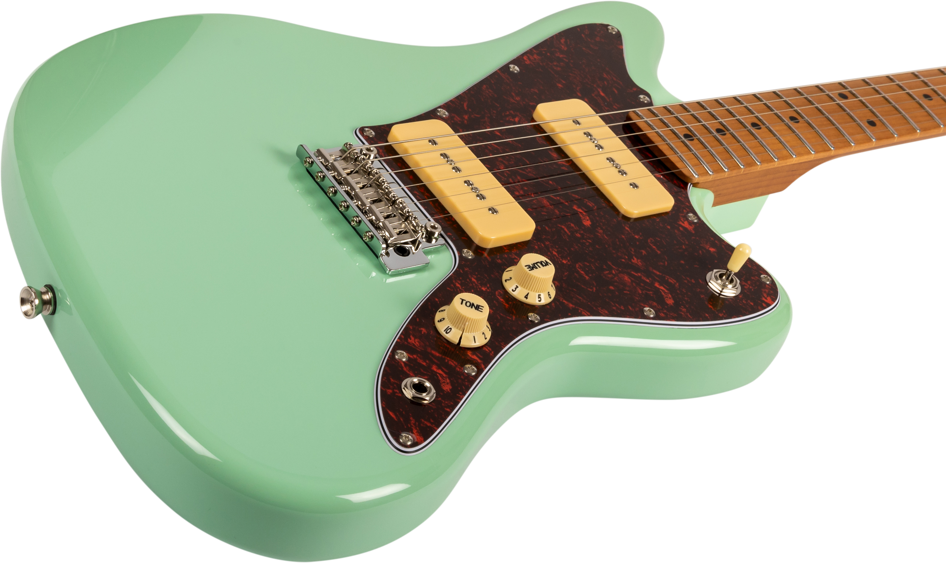 Guitare électrique vert pastel à deux micros crème, plaque marron mouchetée, deux boutons beige, sélecteur de micro et chevalet métallique chromé.