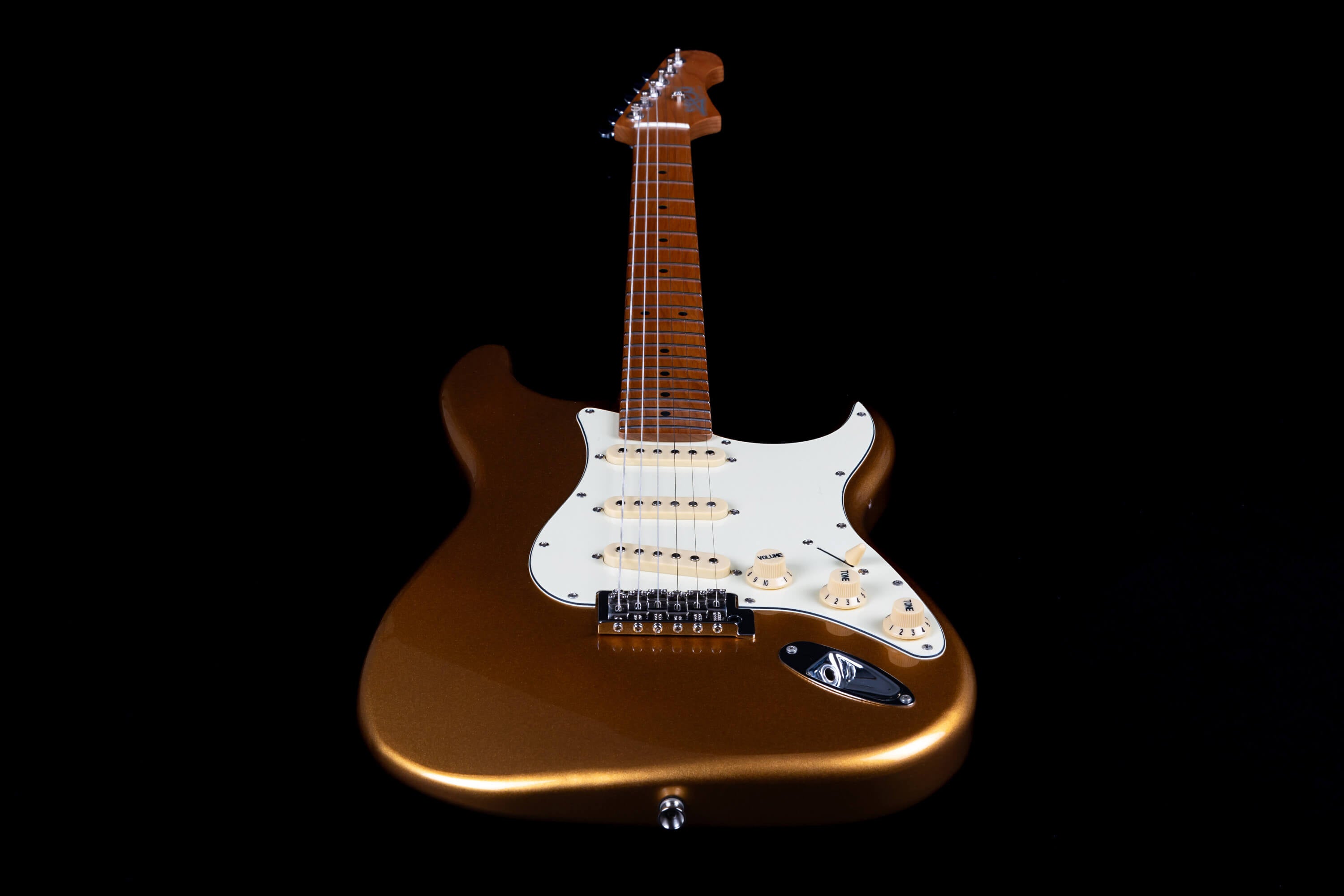 Metallic bronze electric guitar with white pickguard, three single-coil pickups, maple neck, and cream-colored knobs, viewed from the front.