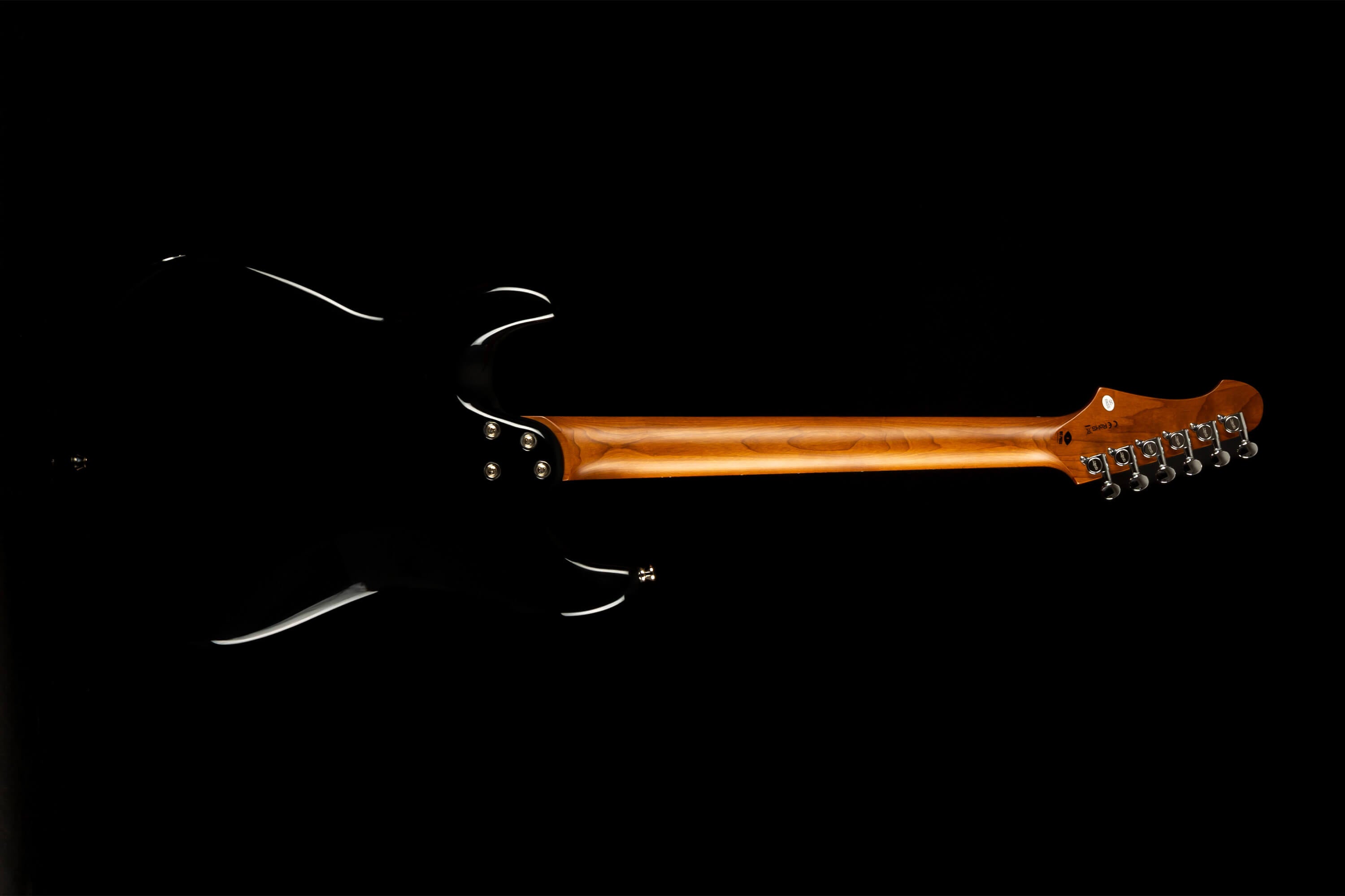 Electric guitar viewed from the back, showing a glossy black body and a natural wood neck with six tuning pegs on the headstock.
