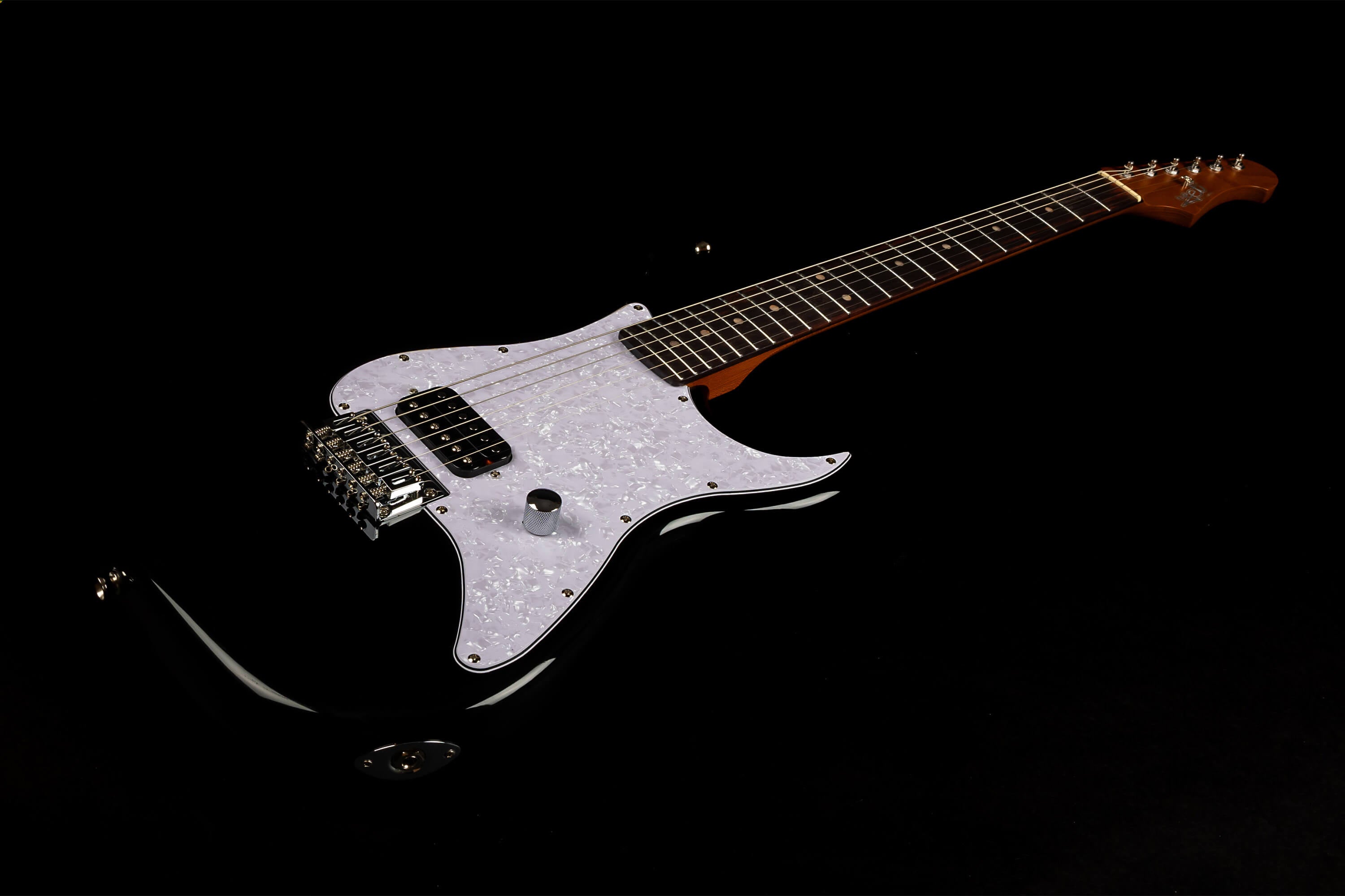 Black electric guitar with a white pearloid pickguard, two pickups, a single knob, and a brown fretboard on a dark background.