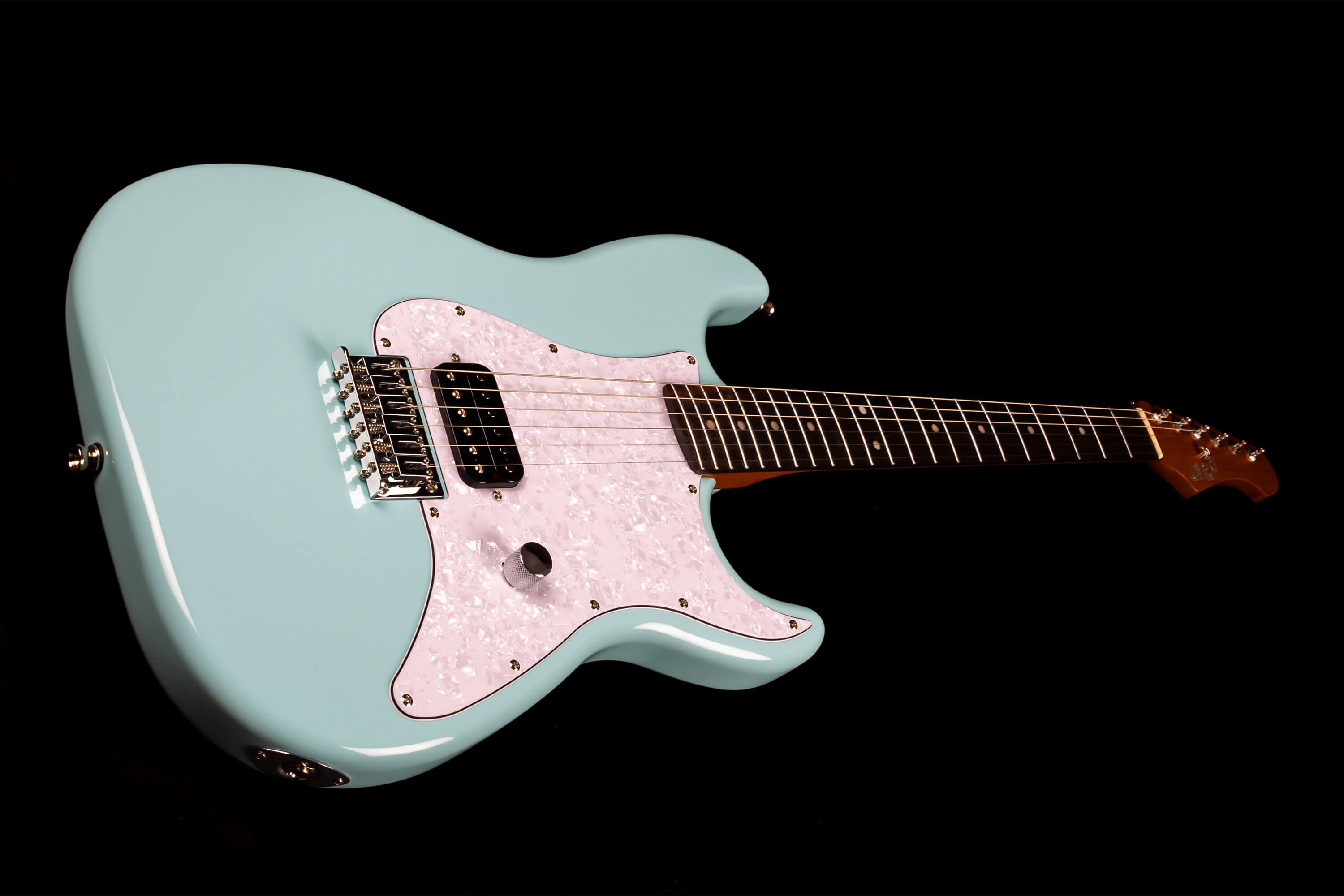 Light blue electric guitar with a white pearloid pickguard, one black pickup, chrome bridge, and a dark fretboard against a black background.