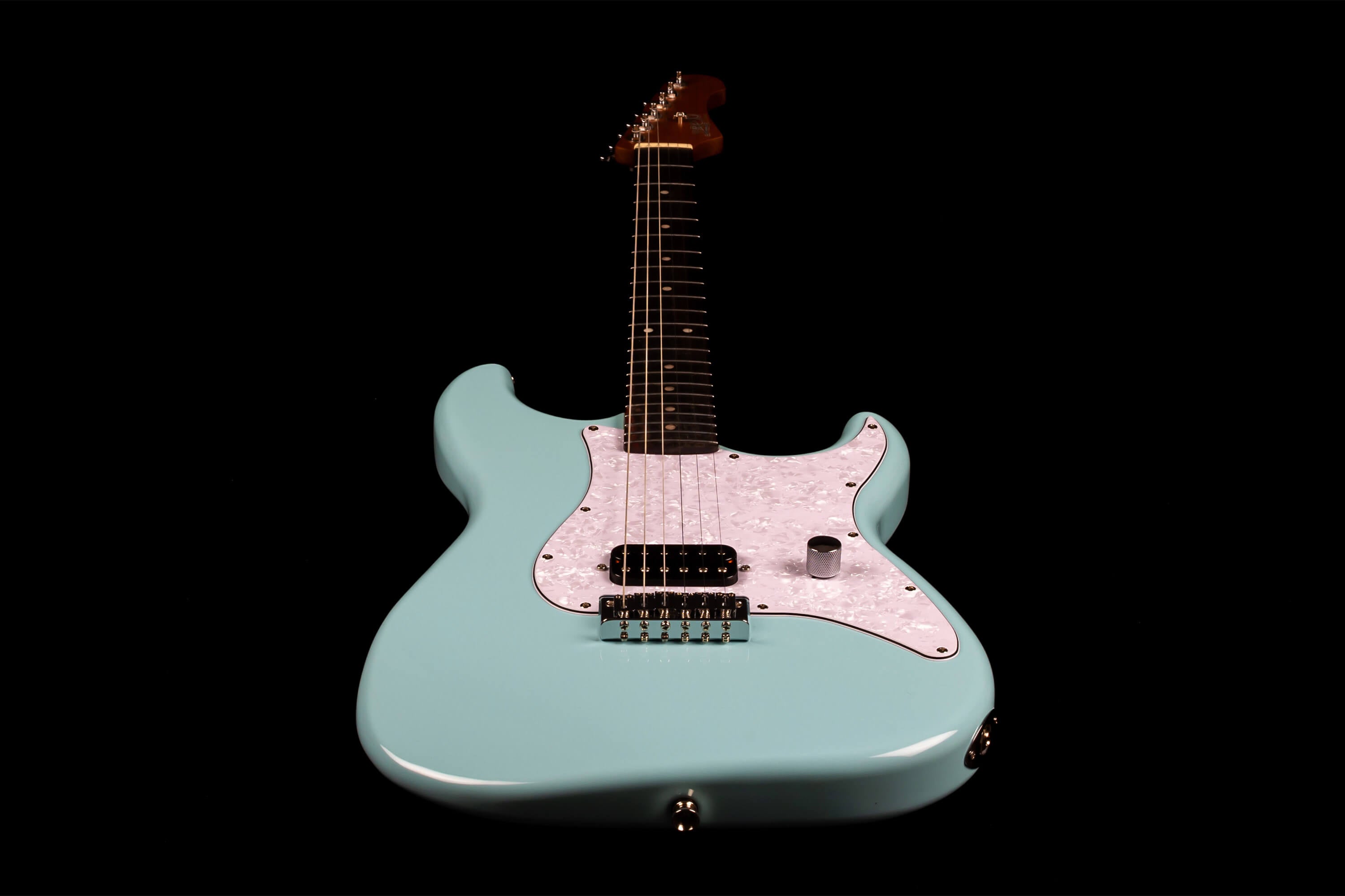 Light blue electric guitar with a white pearloid pickguard, single black pickup, one chrome knob, and a dark fingerboard, shown on a black background.
