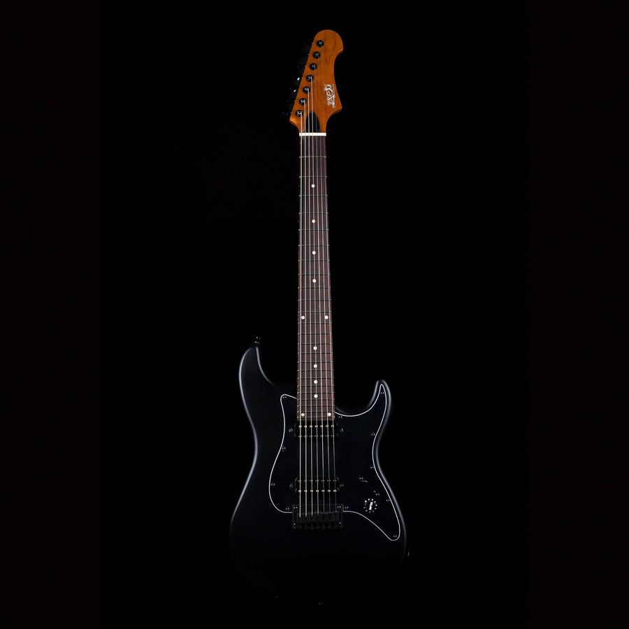 Black electric guitar with a glossy finish, dark pickguard, six strings, and a brown wooden headstock with black tuning pegs.