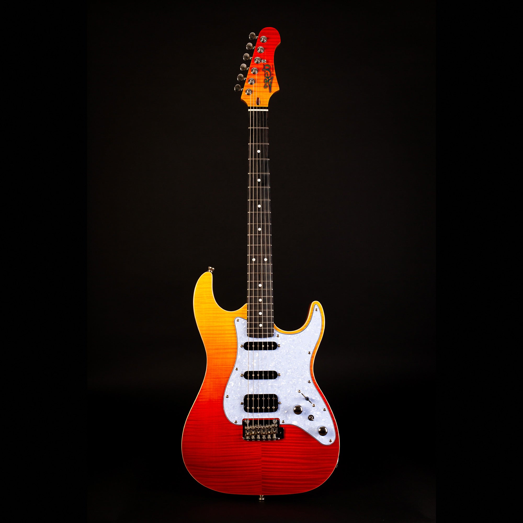 Electric guitar with a sunburst finish fading from yellow to red, three pickups, white pickguard, and six tuning pegs on the headstock.