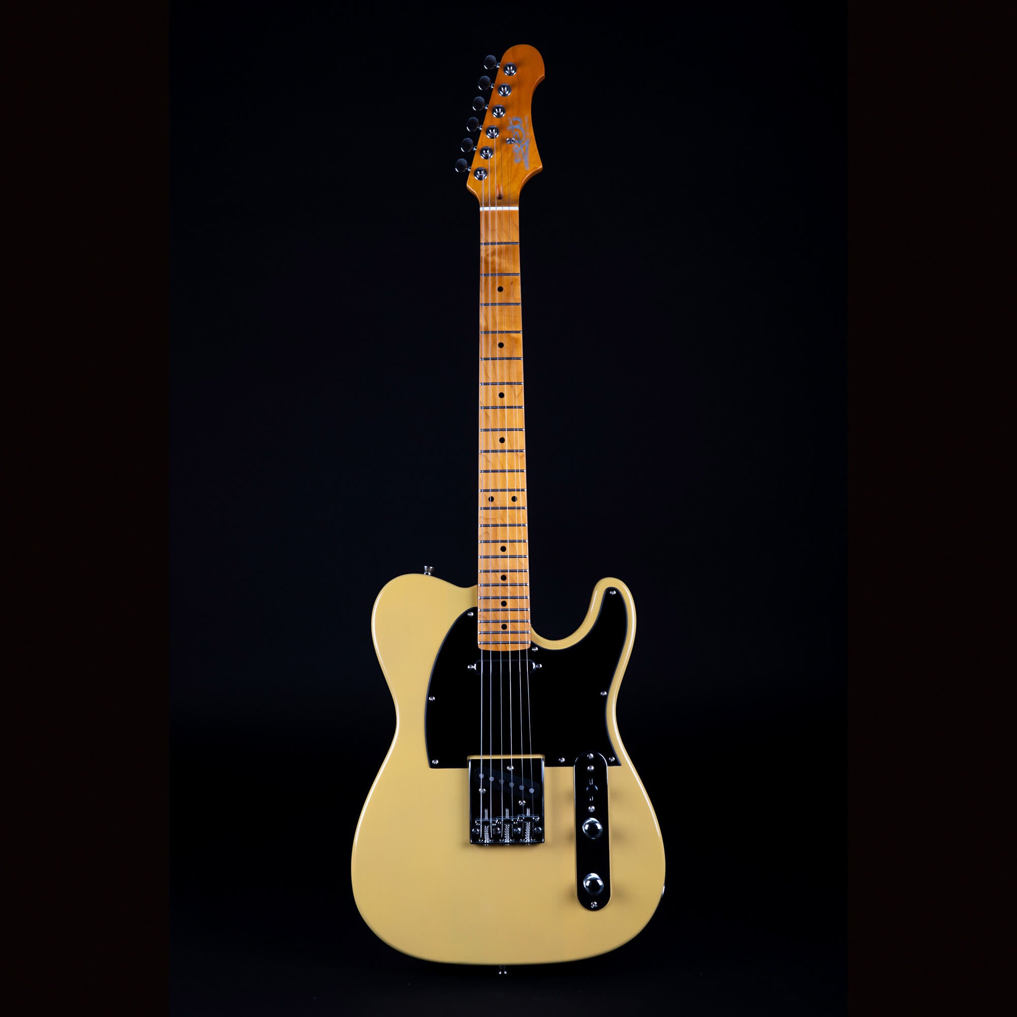 Solid-body electric guitar with a light yellow finish, black pickguard, maple neck, and chrome hardware, photographed against a black background.