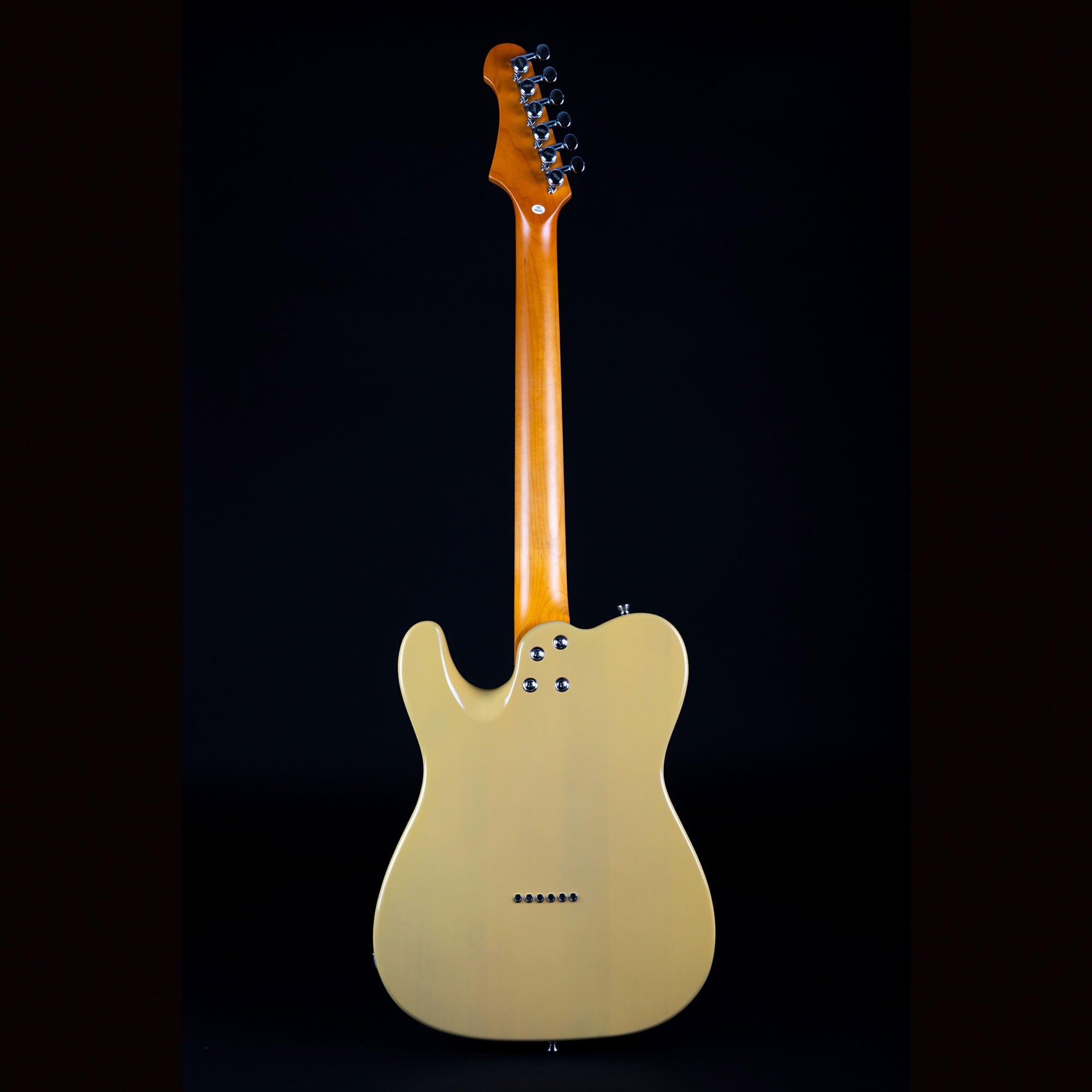 Electric guitar shown from the back, featuring a natural wood neck and a cream-colored solid body with six tuning pegs and six rear string ferrules.