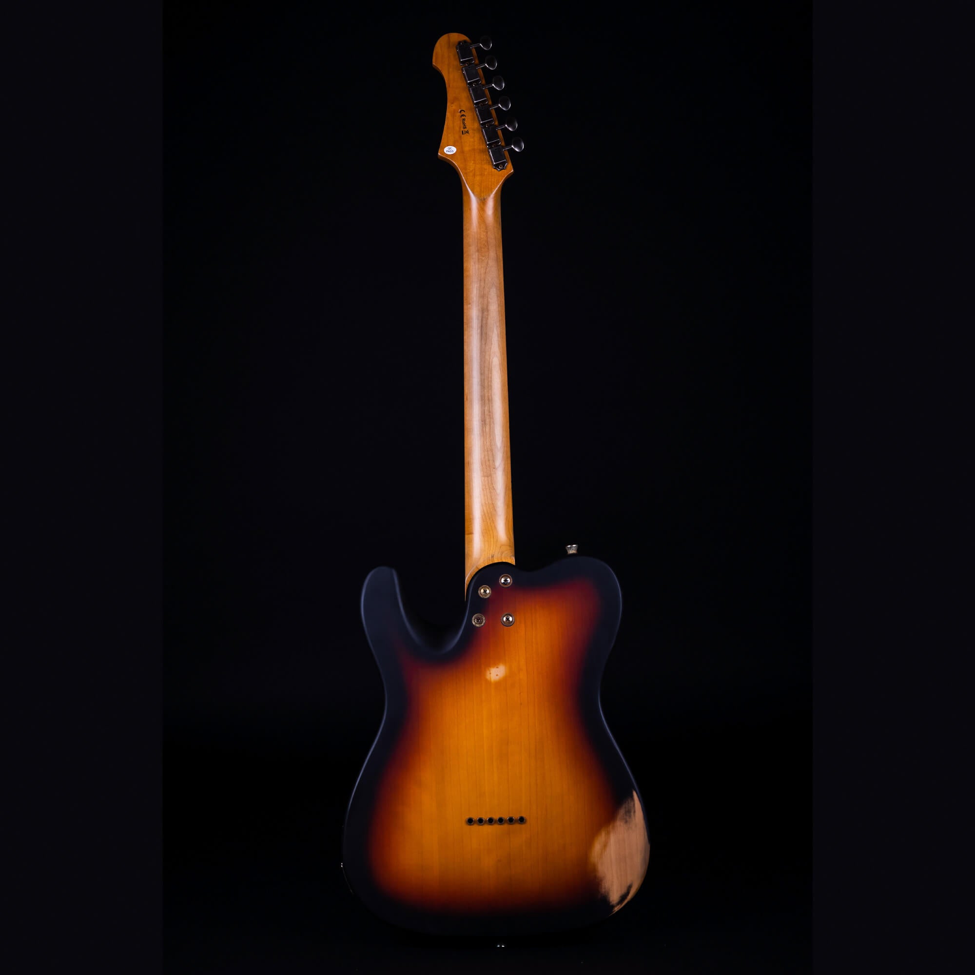 Sunburst electric guitar shown from the back, with a natural wood neck and dark edges around an amber-brown gradient body.