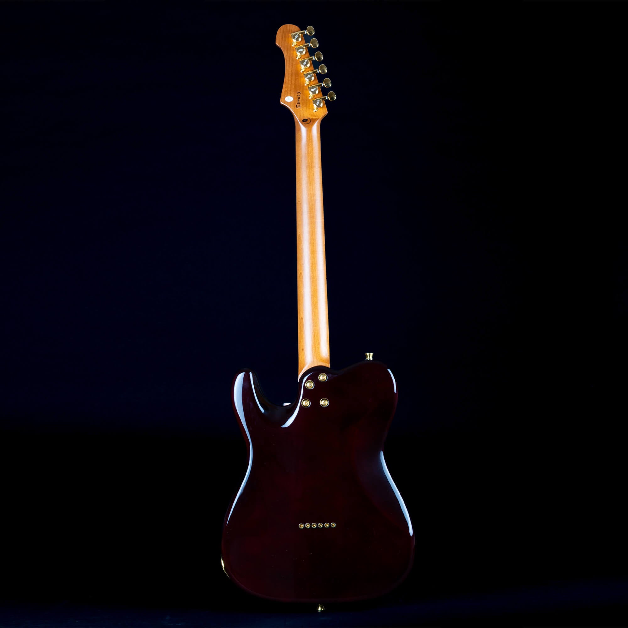 Electric guitar shown from the back, featuring a glossy dark body, natural wood neck, and six tuning pegs with gold hardware.