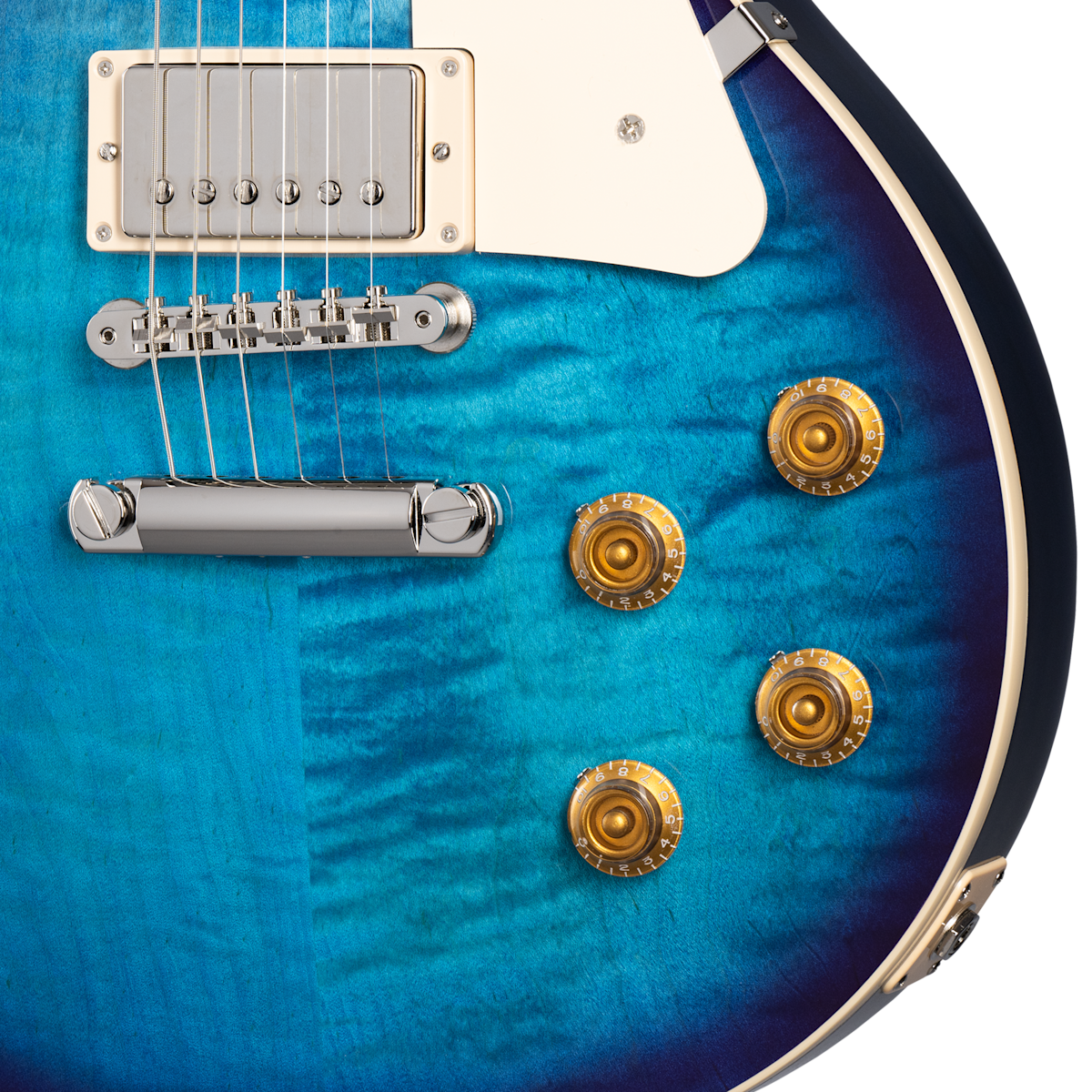 Electric guitar body in glossy blue finish, silver bridge and pickup, four gold control knobs, and white pickguard on the upper right.