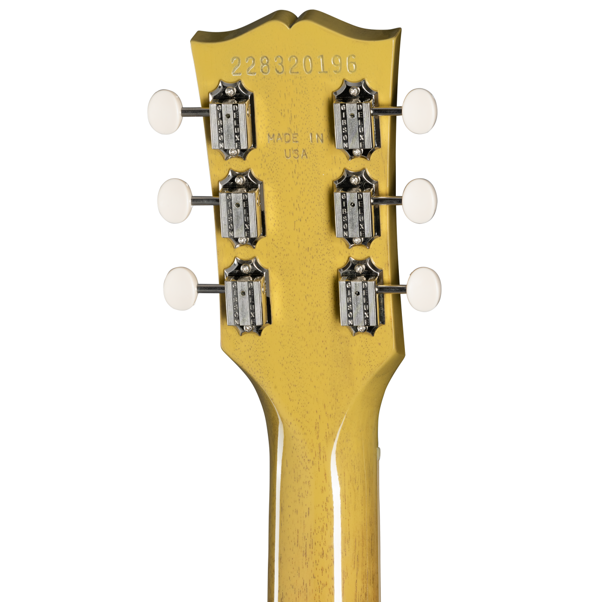 Back of an electric guitar headstock in yellow with six vintage-style tuners, white tuning pegs, serial number, and “Made in USA” text.