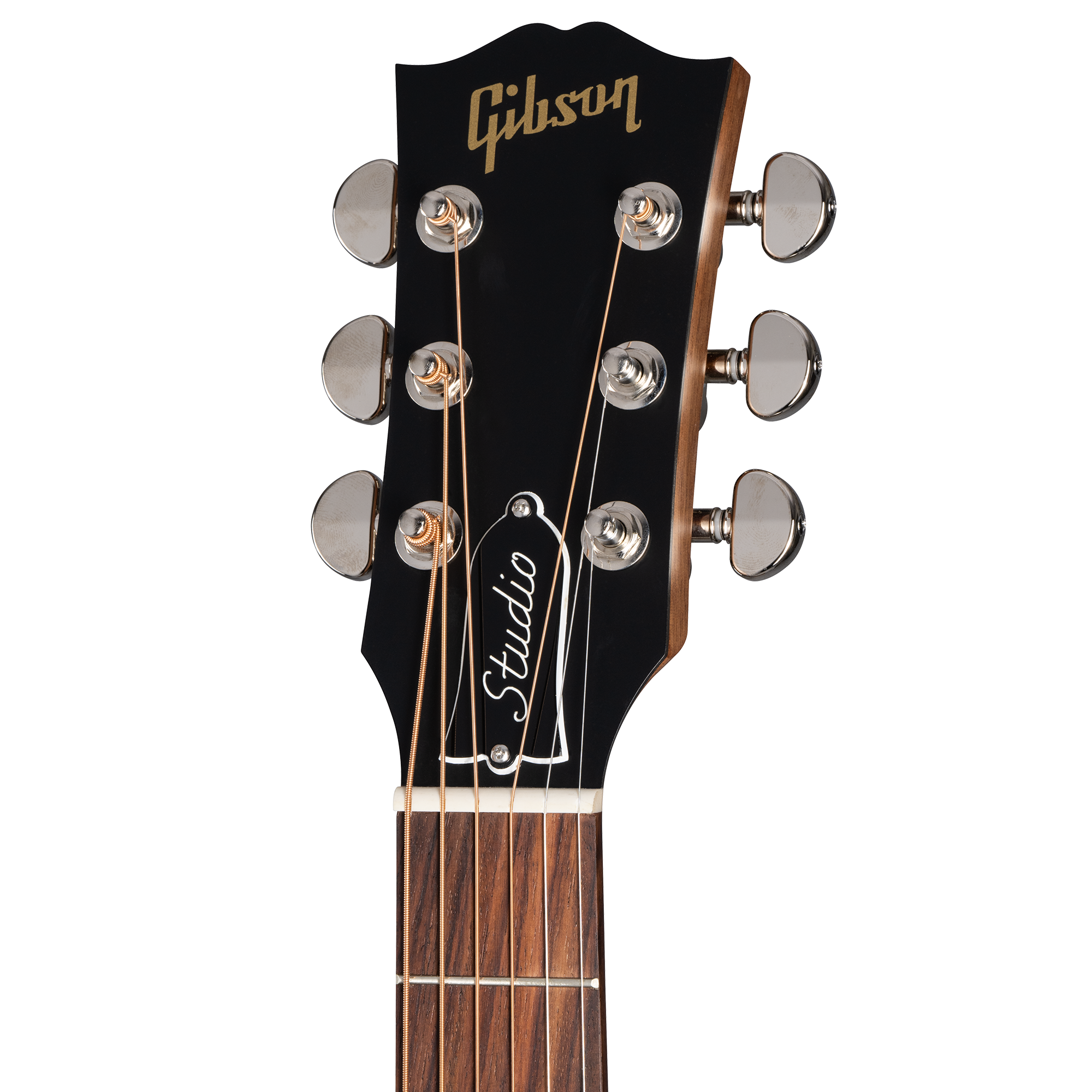 Close-up of a Gibson acoustic guitar headstock with six tuning pegs, gold logo, and a truss rod cover labeled "Studio."