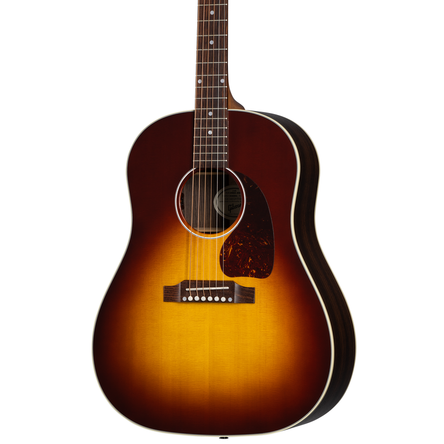 Sunburst-finish acoustic-style electric guitar with a rounded body, white binding, dark tortoiseshell pickguard, and six strings.