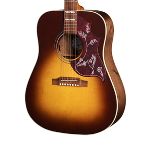 Sunburst Gibson acoustic guitar with a detailed pickguard featuring white bird and floral designs.