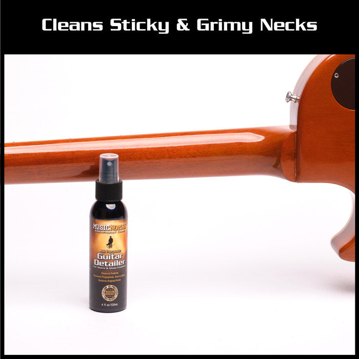 A bottle of all-purpose guitar detailer spray is placed in front of a clean wooden guitar neck, highlighting its use for cleaning instruments.
