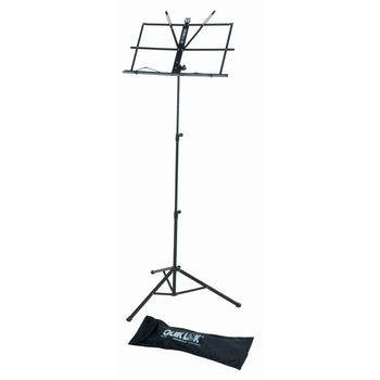Black metal folding music stand with tripod legs, adjustable height, open sheet holder, and a carrying bag placed on the floor.