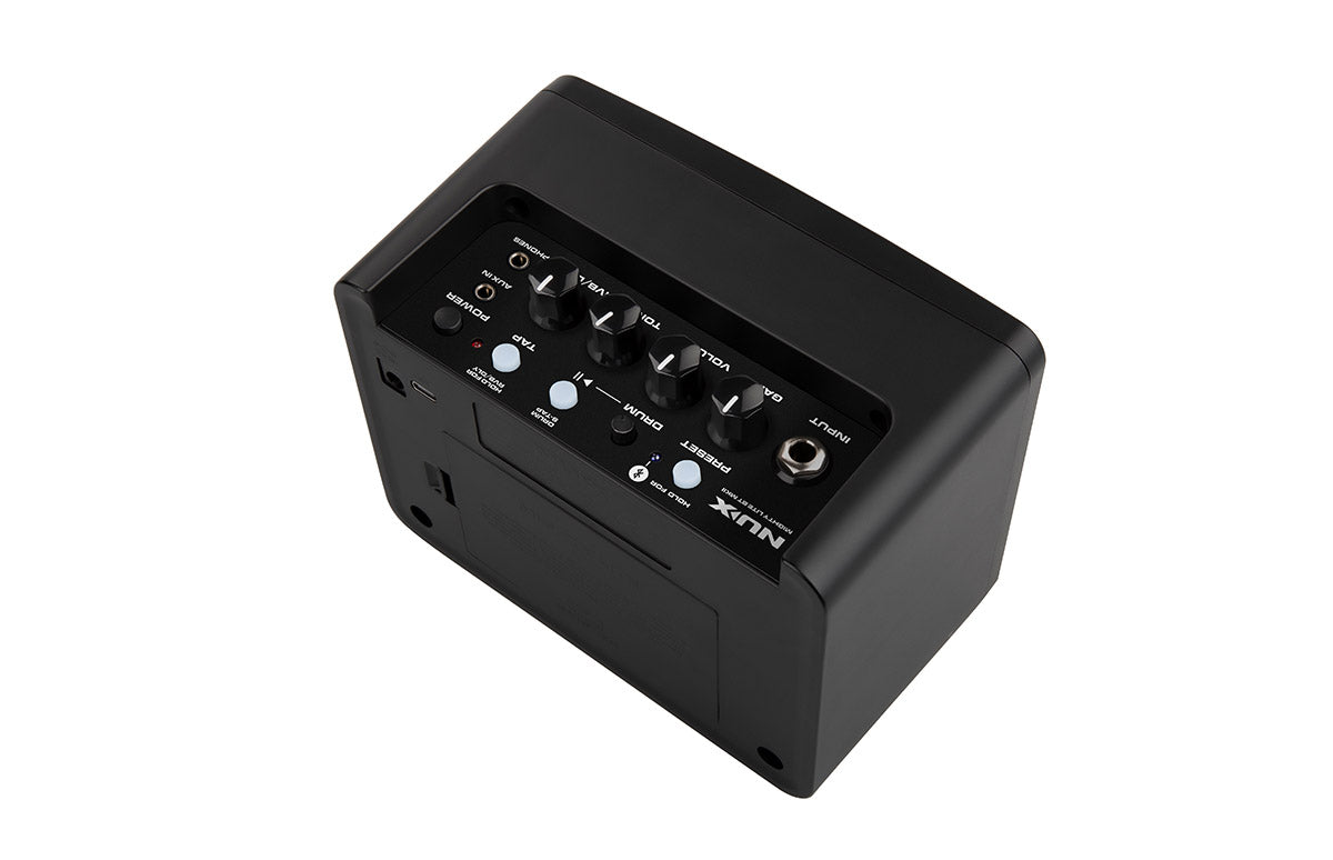 Compact black amplifier with four control knobs, input jack, preset buttons, and headphone and aux-in ports on the top panel.