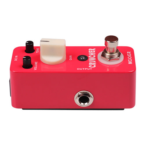 Red Mooer Cruncher effects pedal with three knobs labeled Volume, Tone, and Gain, a footswitch, and an output jack on the front edge.