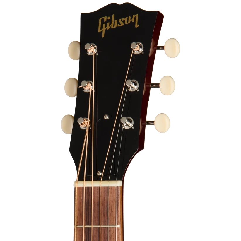 Tête de guitare acoustique noire avec six mécaniques dorées et logo Gibson doré, manche en bois clair visible en bas.