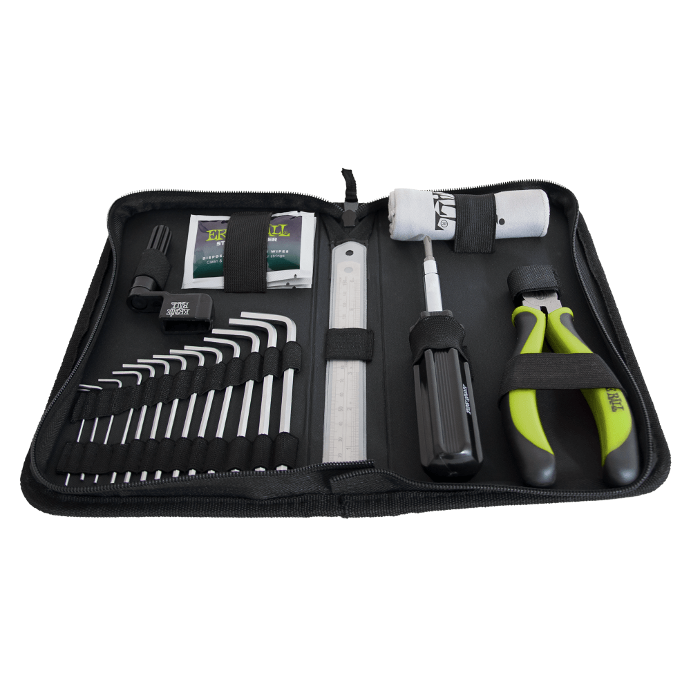 Zippered tool kit holds hex keys, a screwdriver, pliers with green handles, a small ruler, and other bike maintenance accessories in elastic straps.