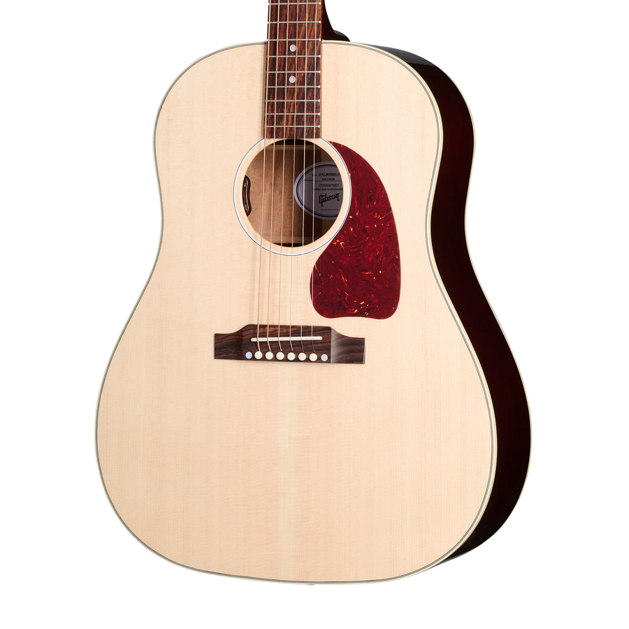 Natural wood acoustic guitar with a rounded body, dark bridge, white dot pins, and a red tortoise-shell style pickguard below the sound hole.
