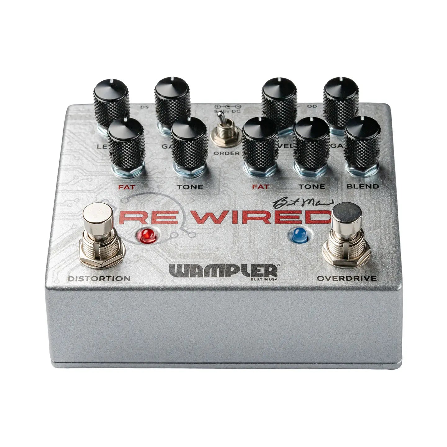 Silver Wampler FX pedal labeled "Re Wired" with two footswitches, eight black knobs, a small toggle switch, and red and blue indicator lights.