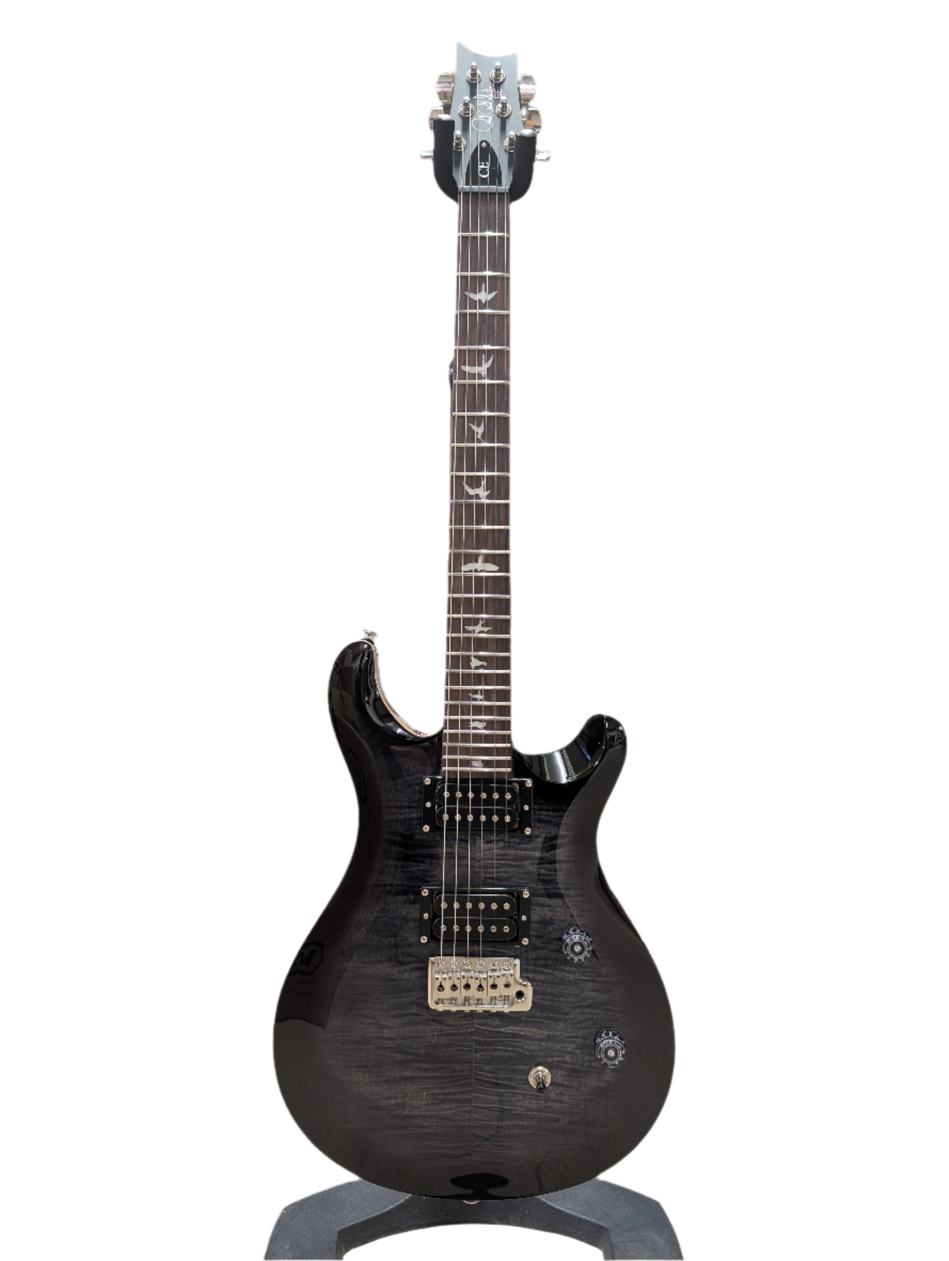 Glossy black electric guitar with two humbucker pickups, bird inlays on a dark fingerboard, three control knobs, and a silver bridge.