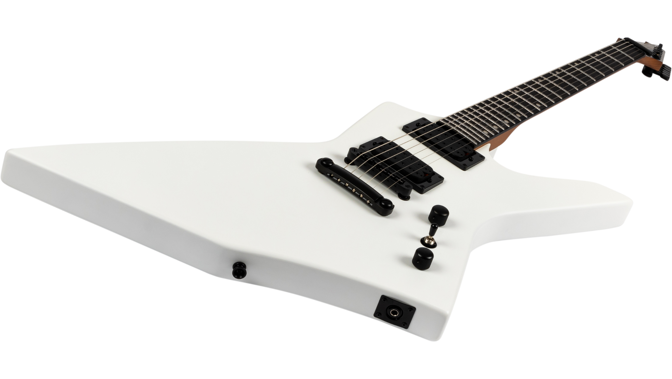 White electric guitar with a sharp, angular body shape, two black pickups, two control knobs, and a black bridge.