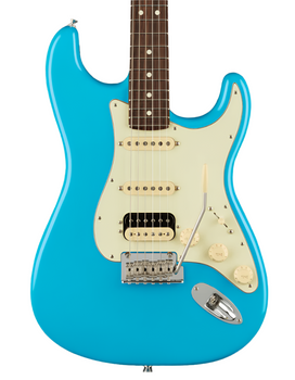 Electric guitar with a bright blue body, cream pickguard, three pickups, five control knobs, and a metal tremolo arm.