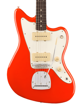 Electric guitar with a bright orange body, white pickguard, two cream pickups, and silver bridge with a tremolo arm. Volume and tone knobs are cream colored.