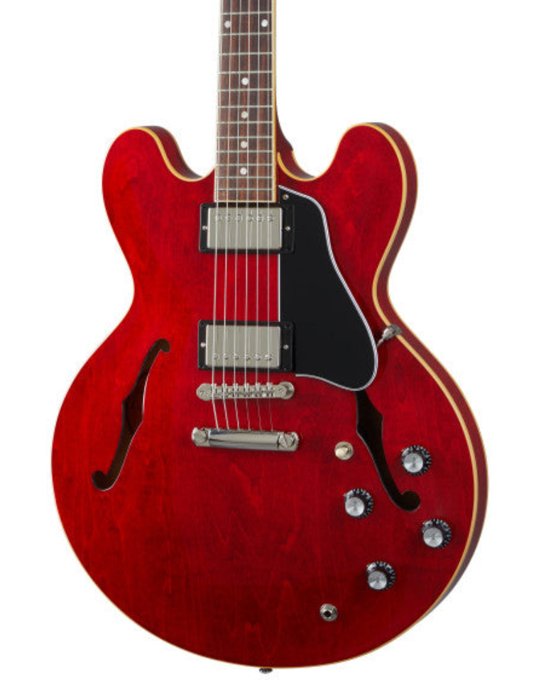 Red semi-hollow electric guitar with two humbucker pickups, black pickguard, four control knobs, and cream binding on the edges.