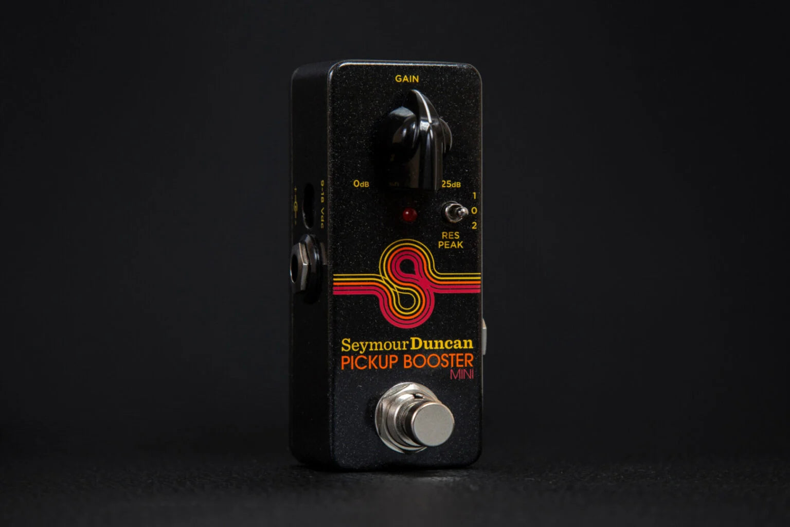 Black Seymour Duncan Pickup Booster Mini effects pedal with one large gain knob, a footswitch, a small red LED, and colorful retro stripes.