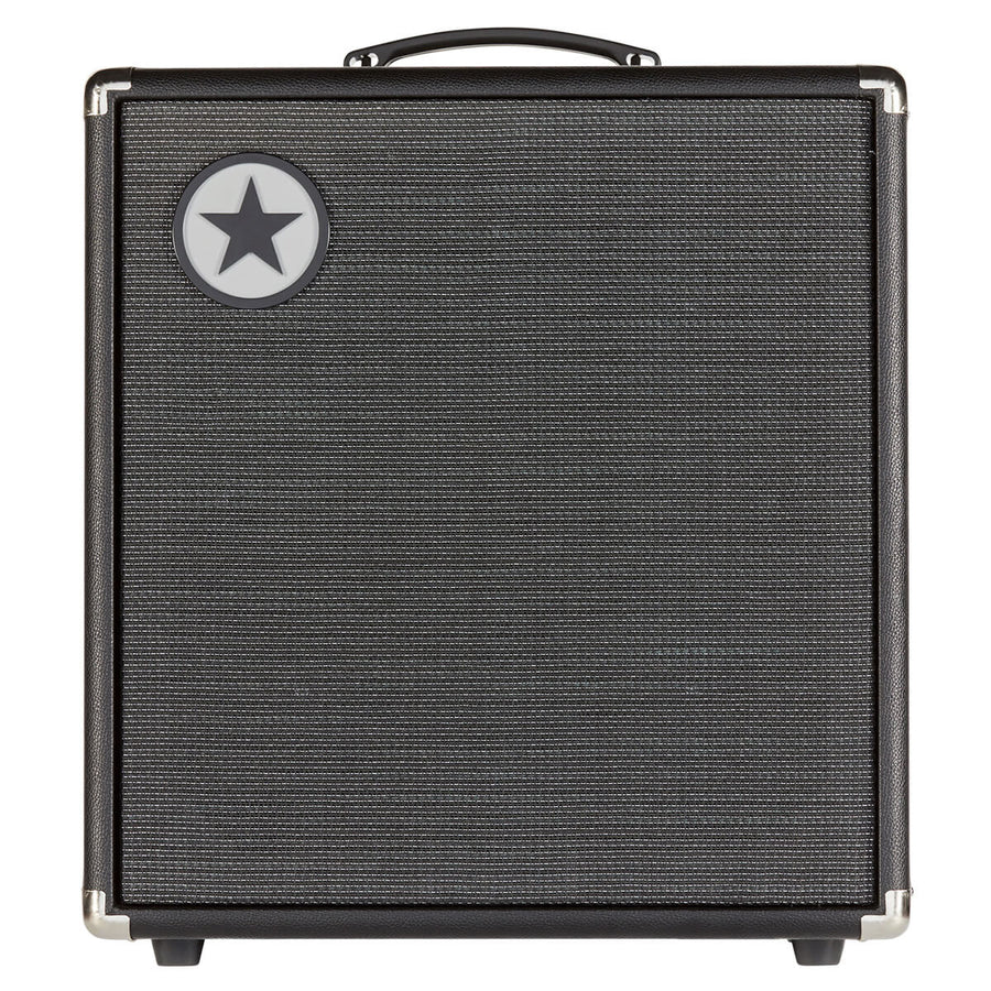 Black amplifier cabinet with a textured front grille, silver corner protectors, and a round badge featuring a black star in the upper left corner.